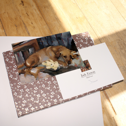Painting of a Golden Labrador dog sleeping on a floral bed with its teddy bears, in warm neutral colours