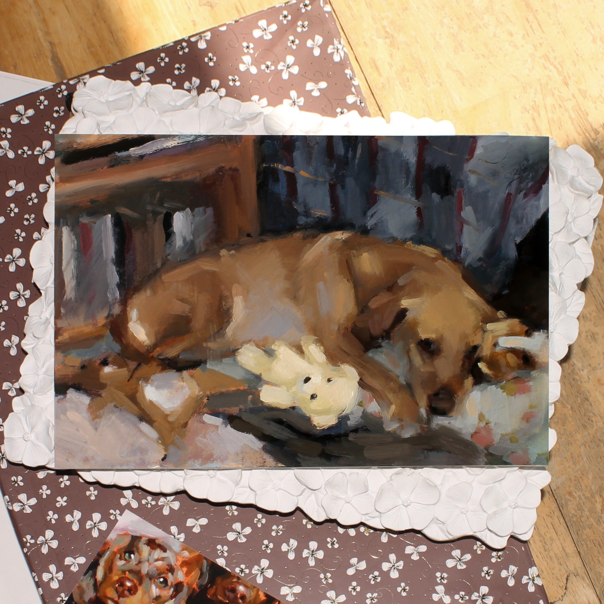 Painting of a Golden Labrador dog sleeping on a floral bed with its teddy bears, in warm neutral colours