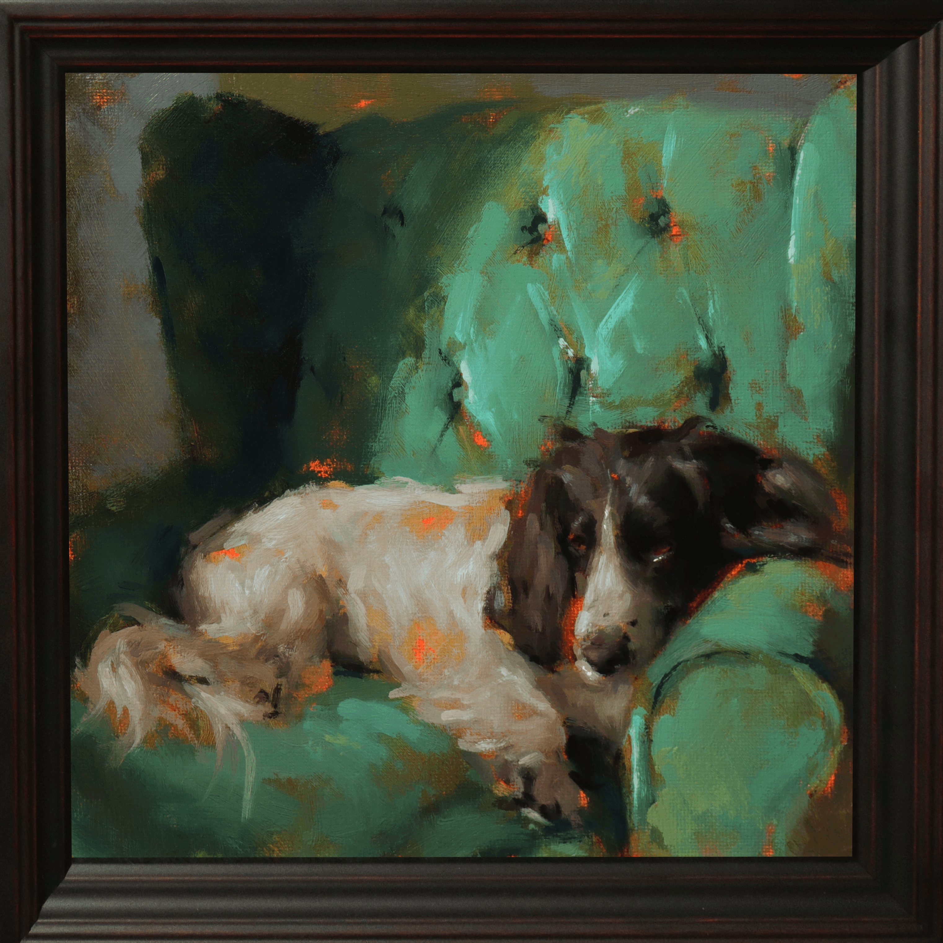 A framed oil painting depicting a black and white dog resting on a green armchair, enclosed in a dark brown wooden frame.