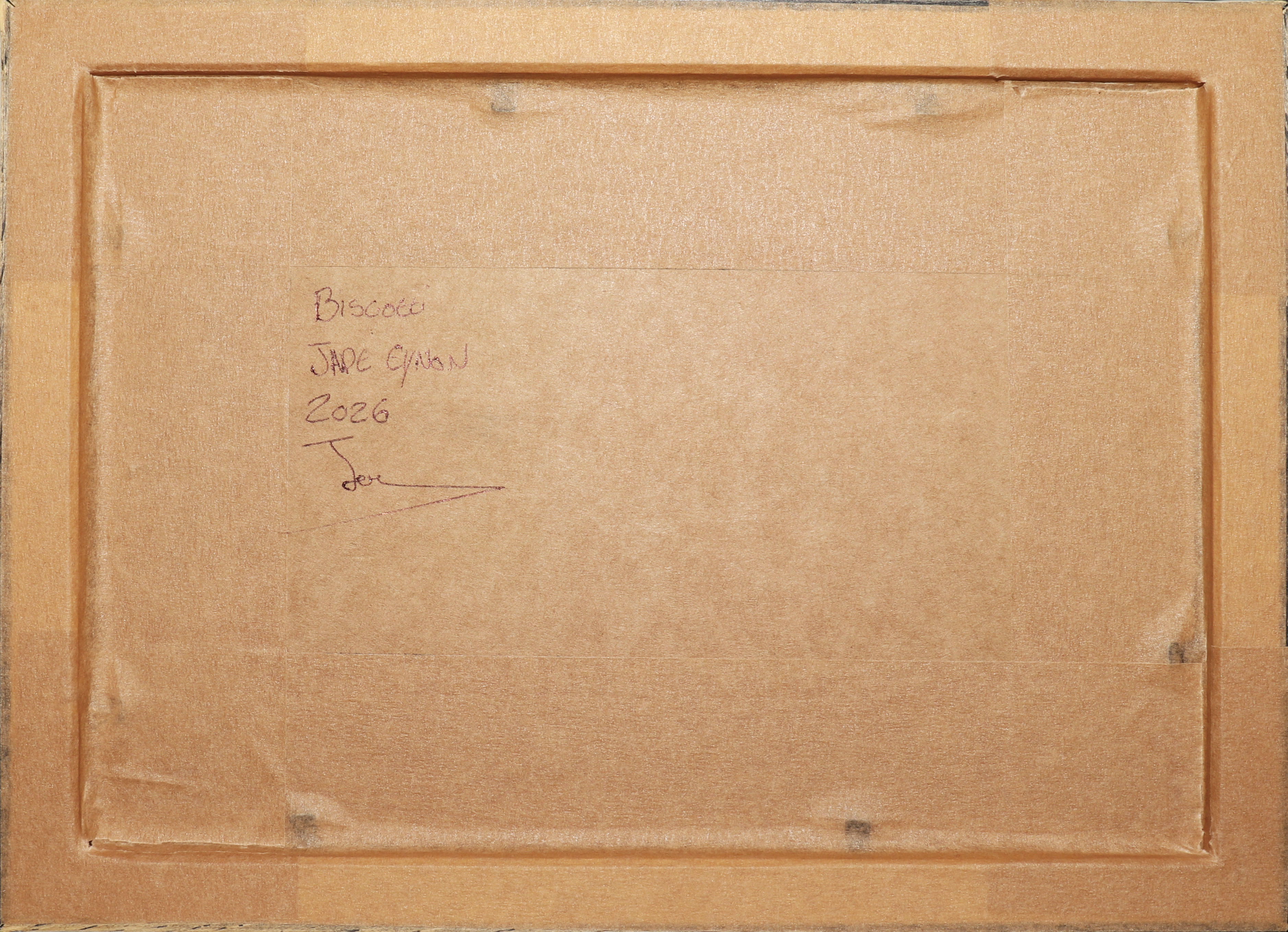 The back of a square framed artwork, showing a tan cardboard backing with handwritten text reading 'Biscotti Jue Oton 2026' and a signature in the upper left.