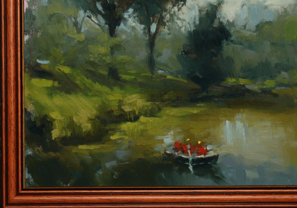 An oil painting of a serene lake scene with a small rowboat carrying two figures in red life jackets, surrounded by lush green trees and grassy banks, housed in a reddish-brown wooden frame.