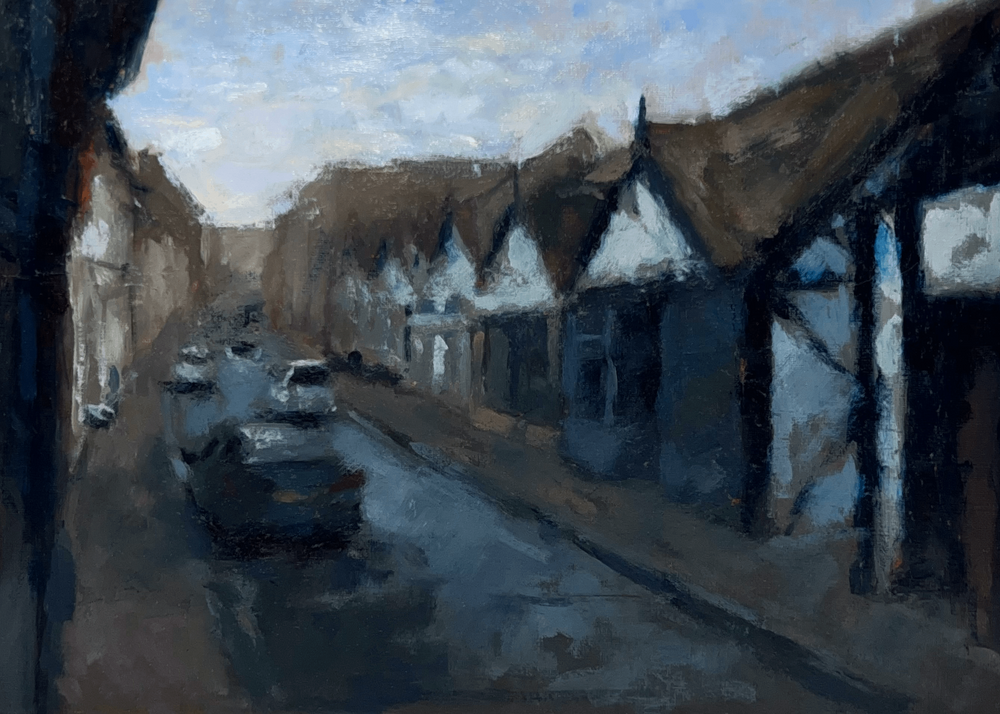 An impressionistic painting of a quiet street scene with dark timber-framed buildings, pale walls, a wet road, and a few cars under a cloudy sky.