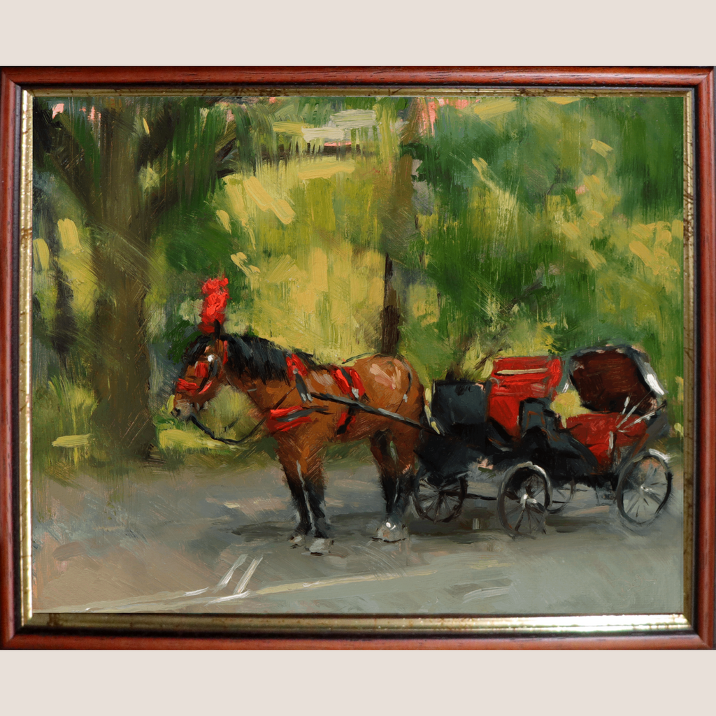 A framed oil painting depicting a brown horse pulling a black carriage with red accents along a path, surrounded by green trees and foliage. The painting is housed in a dark reddish-brown wooden frame with a gold-toned inner border, set against a light beige background.