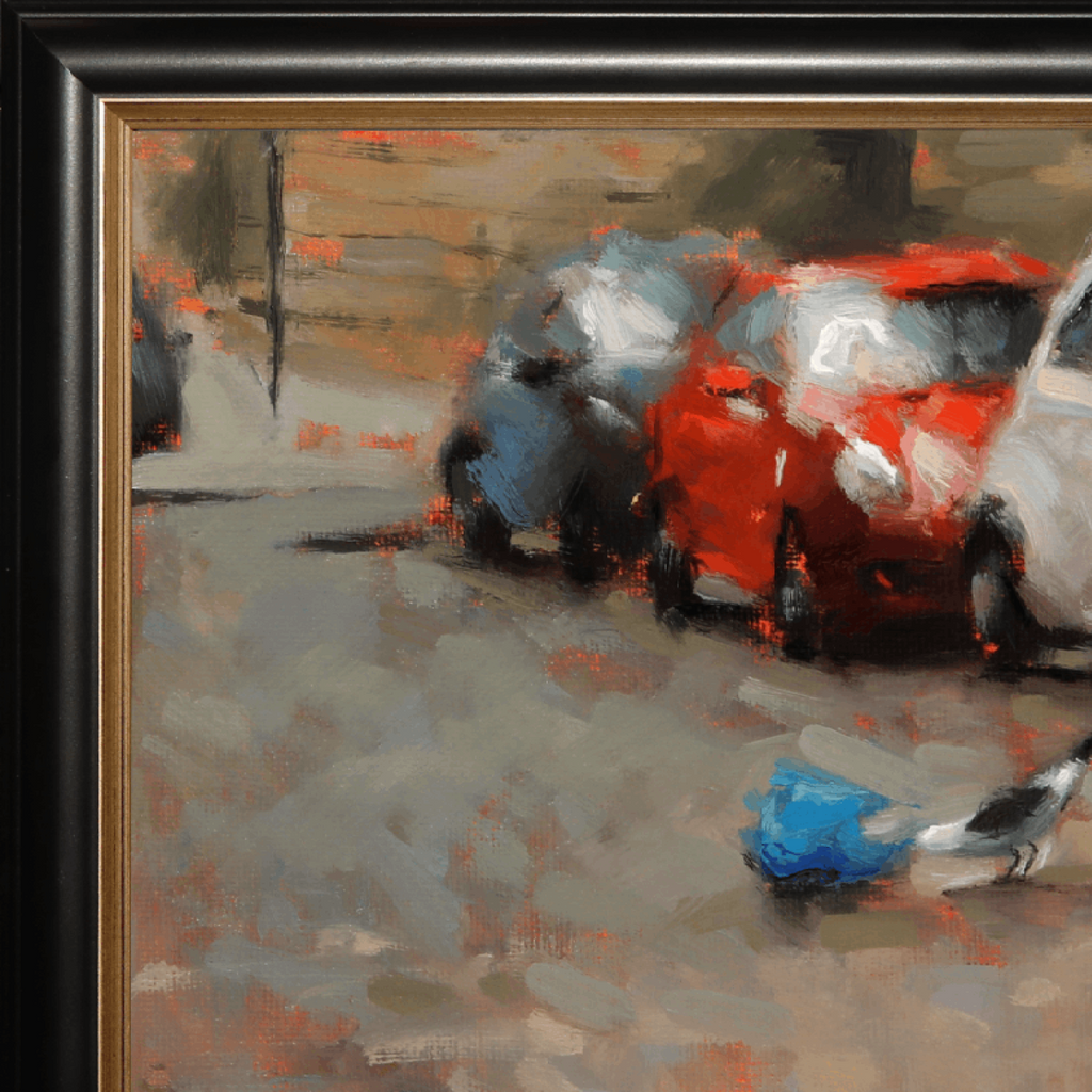 Close-up of a framed painting showing parked cars in an urban street scene, with a red car most prominent, gray pavement, and a small blue-and-white bird in the foreground. The painting is enclosed in a black frame with a gold inner border.