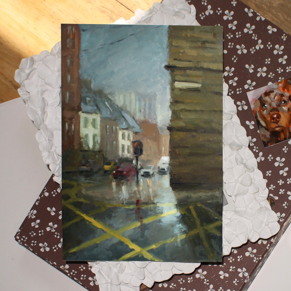 Painting of a rainy city street with pedestrians and cars, framed by decorative elements.