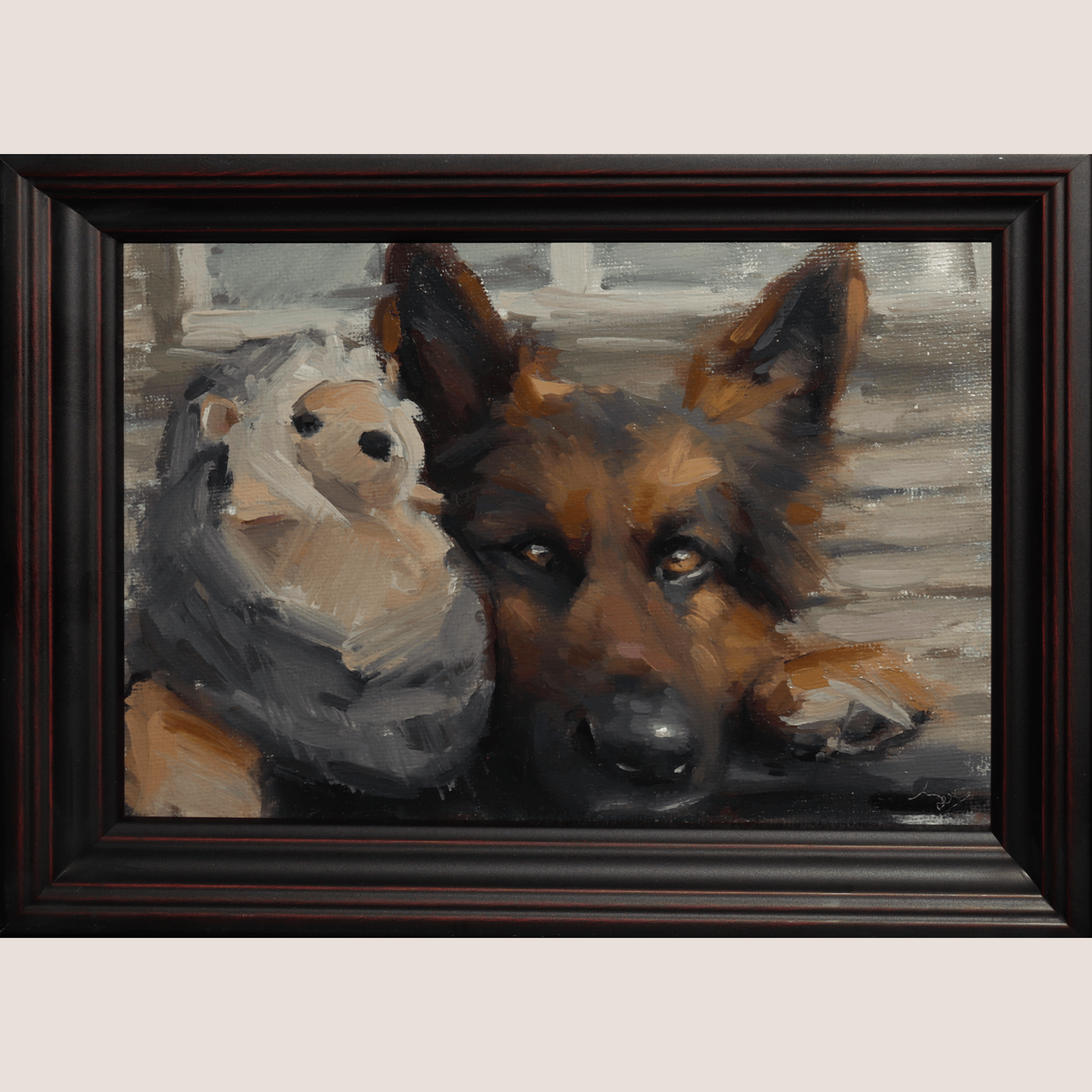 A framed custom oil painting depicting a German Shepherd dog resting next to a small stuffed hedgehog, presented in a dark wood frame against a light beige background.