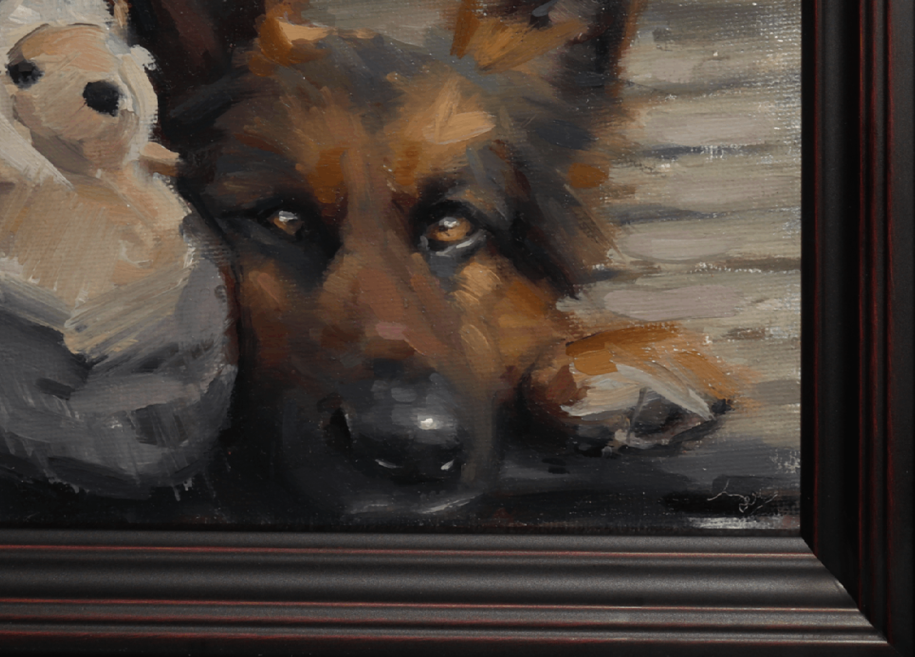 Close-up of a framed painting depicting a German Shepherd dog with a teddy bear on the left, shown in a dark wood frame.