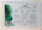Back side of a Winsor & Newton Artists' Canvas Board sheet, showing product information, barcode, and a green paint swatch on a white package.