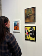 Person looking at artwork on a wall